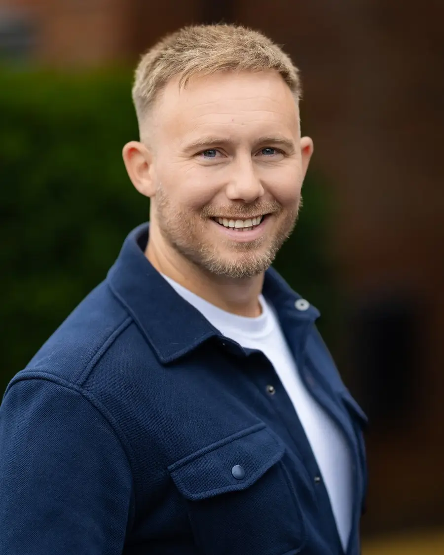 Jamie Burke outside a client's home in Worsley